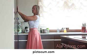 Amazing blonde granny likes to lift her skirt in front of the web camera and tease