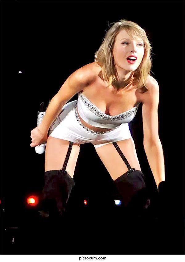 Taylor Swift bent over, nearly spilling out