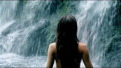 Poppy Drayton getting all wet literally in this sexy zoom in shot into the waterfall showing just enough to imagine her petite slim figure
