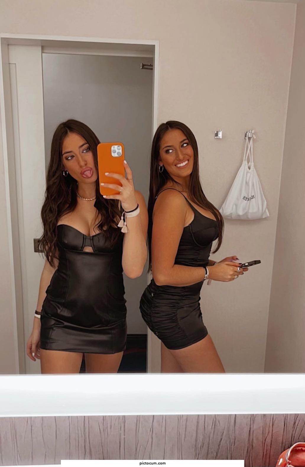 Twins in tight black dresses