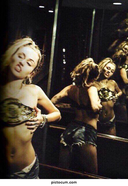 Miley Cyrus with WWE belt