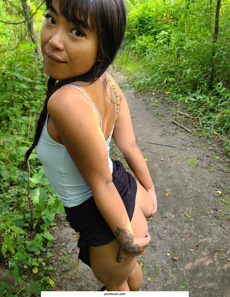 asian cheeks spread open in the woods