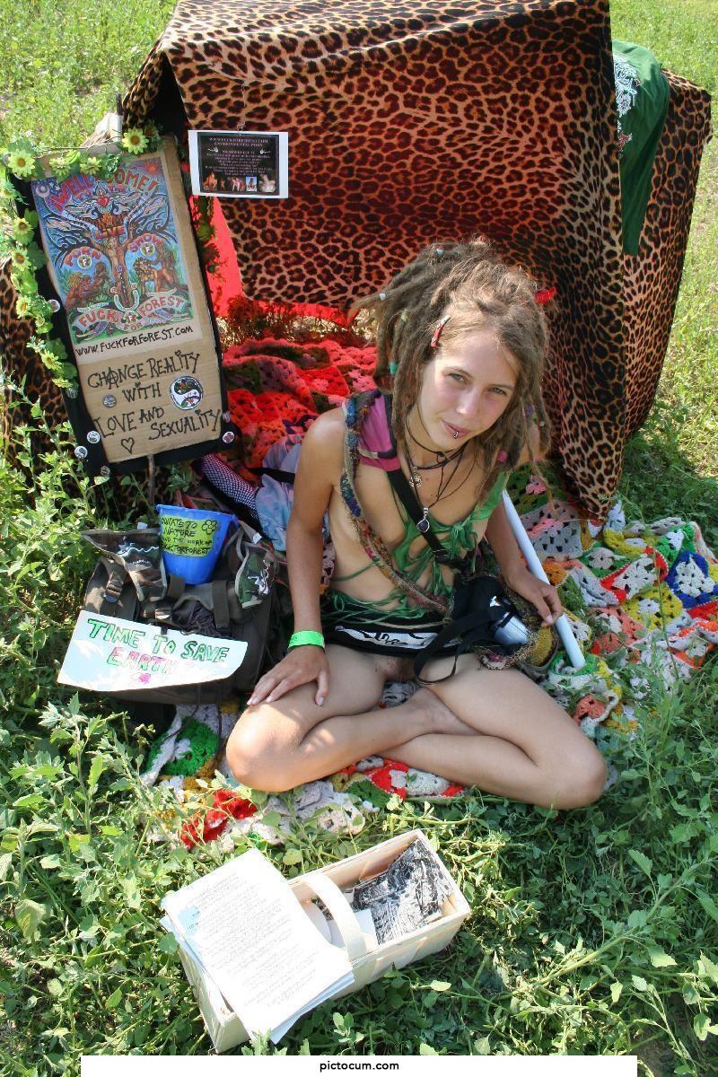 Leona, hippie Chick from fuck for forest selling something at a festival. nice dreads!