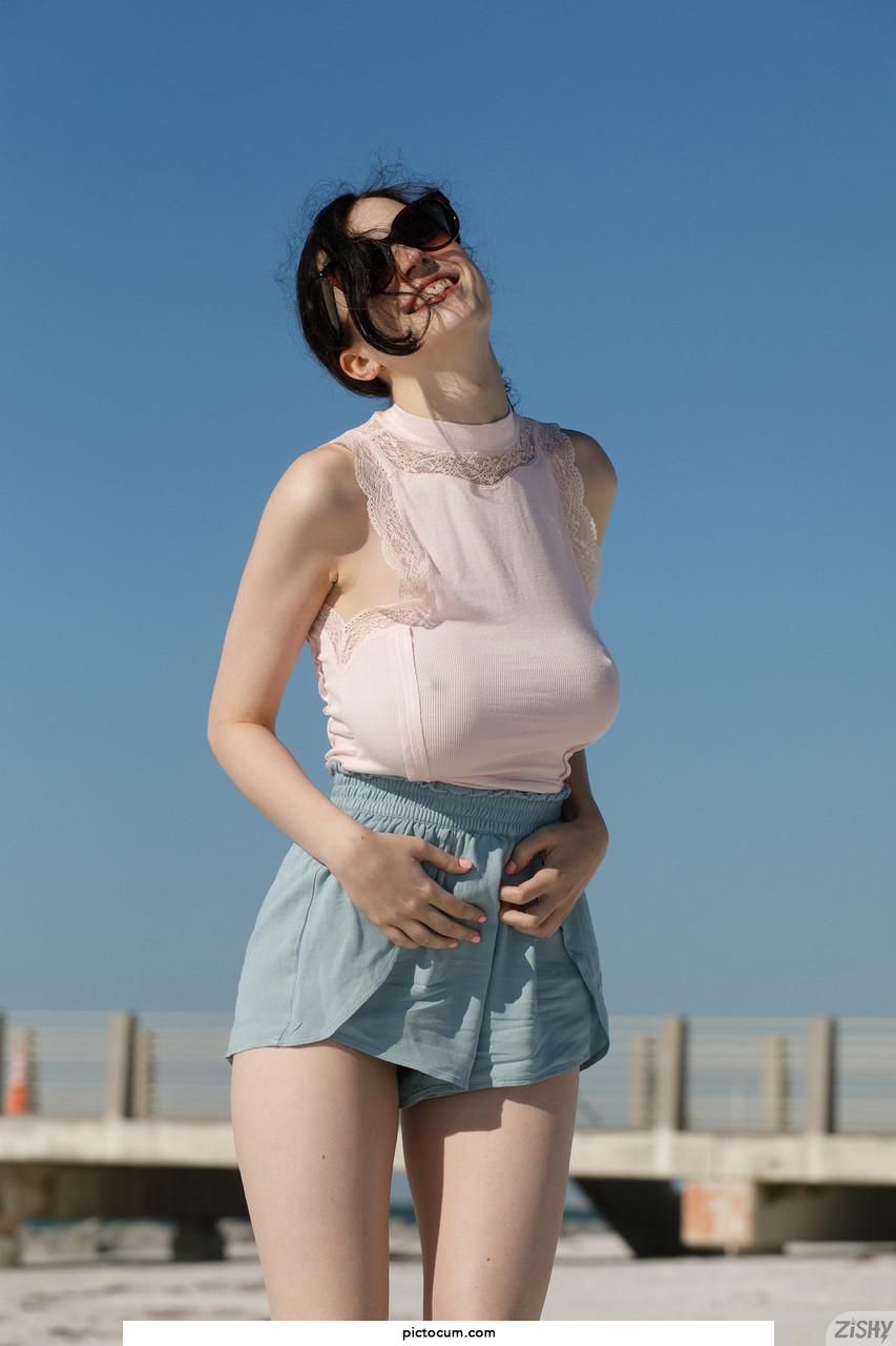 Brunette Ukrainian teen Giulia Wylde exposes her saggy natural tits