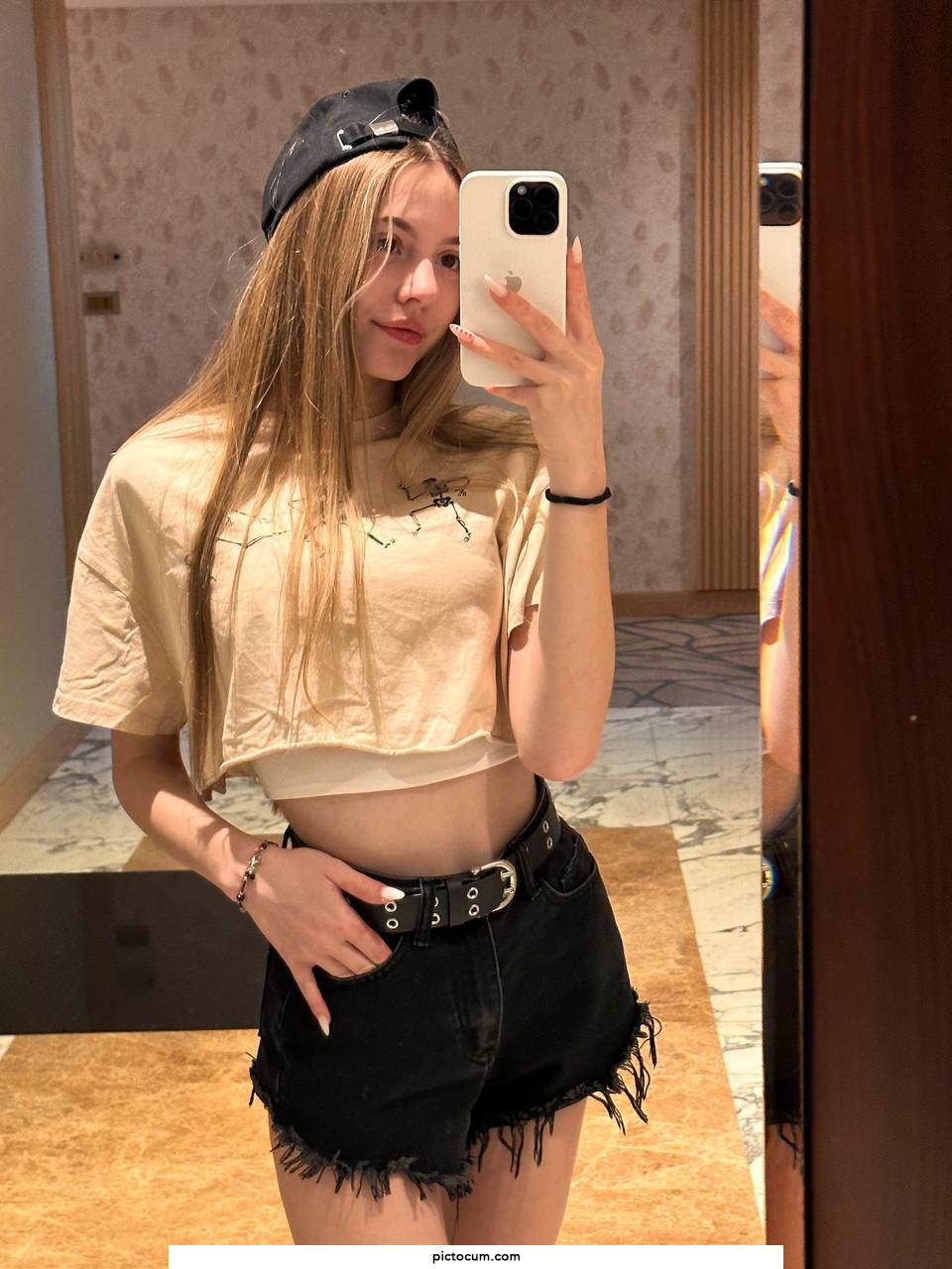 Charming blonde teen Katya Sun takes numerous self shots in SFW mode
